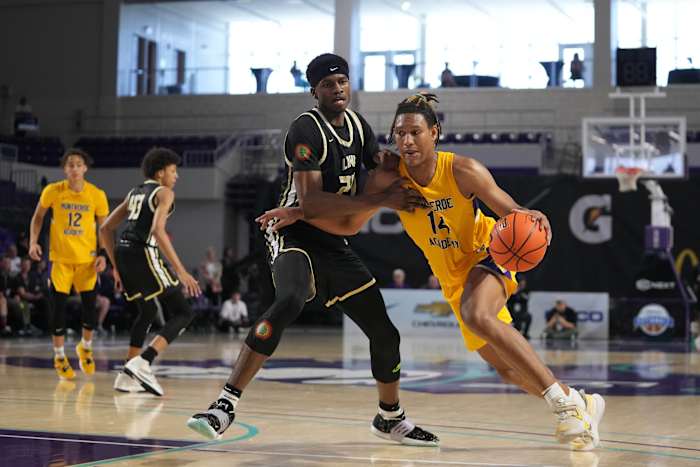 forward Malik Reneau (14) drives the ball around Link Academy Lions center Felix Okpara (24) during the second half at Suncoast Credit Union Arena. (Jasen Vinlove-USA TODAY Sports)